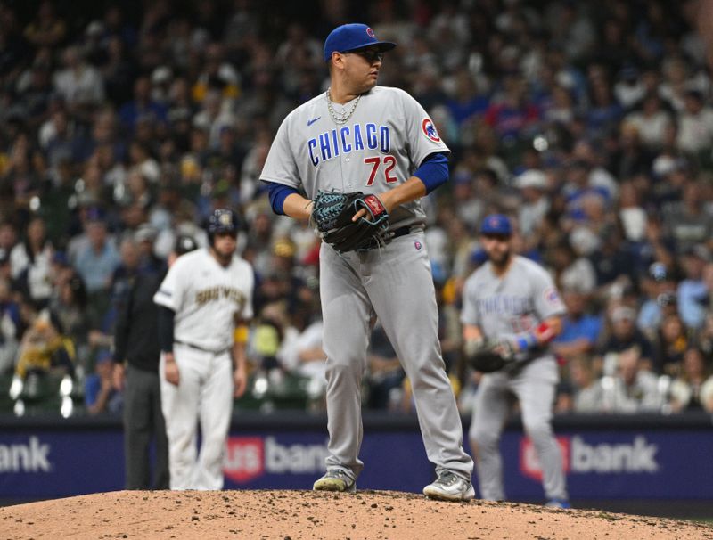 Sep 30, 2023; Milwaukee, Wisconsin, USA; Chicago Cubs relief pitcher Javier Assad (72) prepares to deliver a pitch against the Milwaukee Brewers in the fifth inning at American Family Field. Mandatory Credit: Michael McLoone-USA TODAY Sports