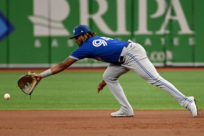 Mar 9, 2023; St. Petersburg, Florida, USA; Toronto Blue Jays first baseman Rainer Nunez (94) attempts to field a ground ball in the first inning of a spring training game against the Tampa Bay Rays at Tropicana Field. Mandatory Credit: Jonathan Dyer-USA TODAY Sports