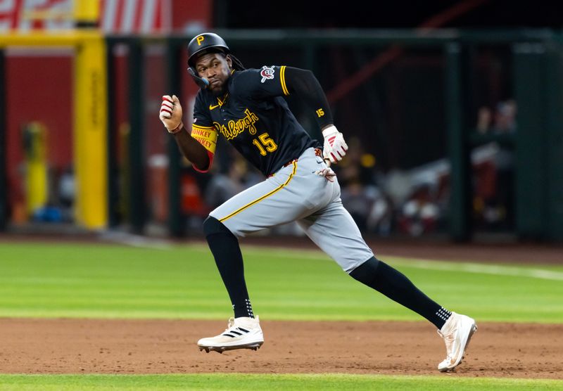 May 27, 2025; Phoenix, Arizona, USA; Pittsburgh Pirates base runner Oneil Cruz during an eighth inning stolen base attempt against the Arizona Diamondbacks at Chase Field. Mandatory Credit: Mark J. Rebilas-Imagn Images