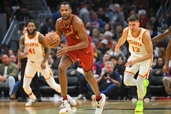 CLEVELAND, OHIO - NOVEMBER 28: Evan Mobley #4 of the Cleveland Cavaliers brings the ball up court during the third quarter of an NBA In-Season Tournament game against the Atlanta Hawks at Rocket Mortgage Fieldhouse on November 28, 2023 in Cleveland, Ohio. The Cavaliers defeated the Hawks 128-105. NOTE TO USER: User expressly acknowledges and agrees that, by downloading and or using this photograph, User is consenting to the terms and conditions of the Getty Images License Agreement. (Photo by Jason Miller/Getty Images)