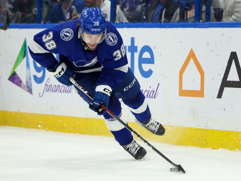 Feb 22, 2024; Tampa, Florida, USA;  Tampa Bay Lightning left wing Brandon Hagel (38) controls the puck against the Washington Capitals in the second period at Amalie Arena. Mandatory Credit: Nathan Ray Seebeck-USA TODAY Sports