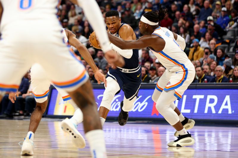 DENVER, COLORADO - NOVEMBER 6: Russell Westbrook #4 of the Denver Nuggets drives against Luguentz Dort #5 of the Oklahoma City Thunder in the second quarter at Ball Arena on November 6, 2024 in Denver, Colorado. NOTE TO USER: User expressly acknowledges and agrees that, by downloading and/or using this Photograph, user is consenting to the terms and conditions of the Getty Images License Agreement. (Photo by Jamie Schwaberow/Getty Images)