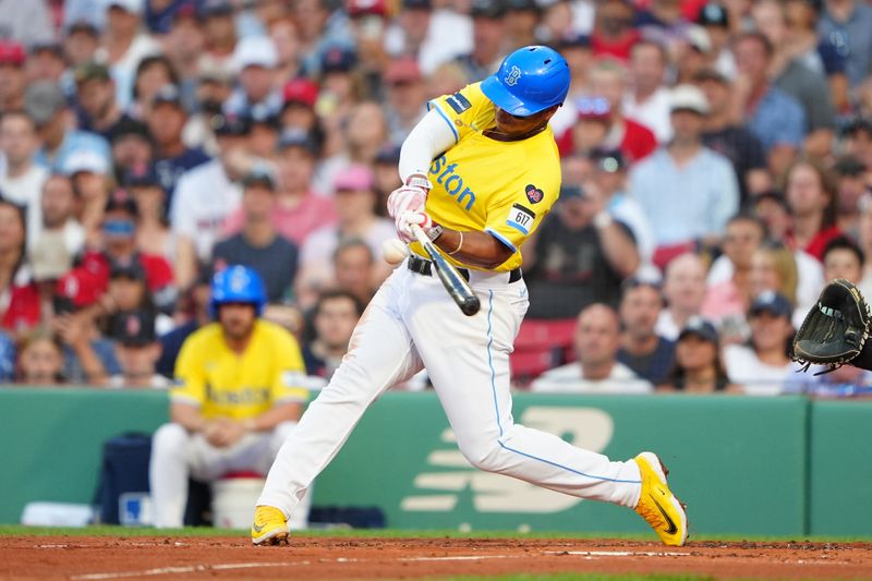 Jul 27, 2024; Boston, Massachusetts, USA; Boston Red Sox third baseman Rafael Devers (11) hits a single against the New York Yankees during the first inning at Fenway Park. Mandatory Credit: Gregory Fisher-USA TODAY Sports