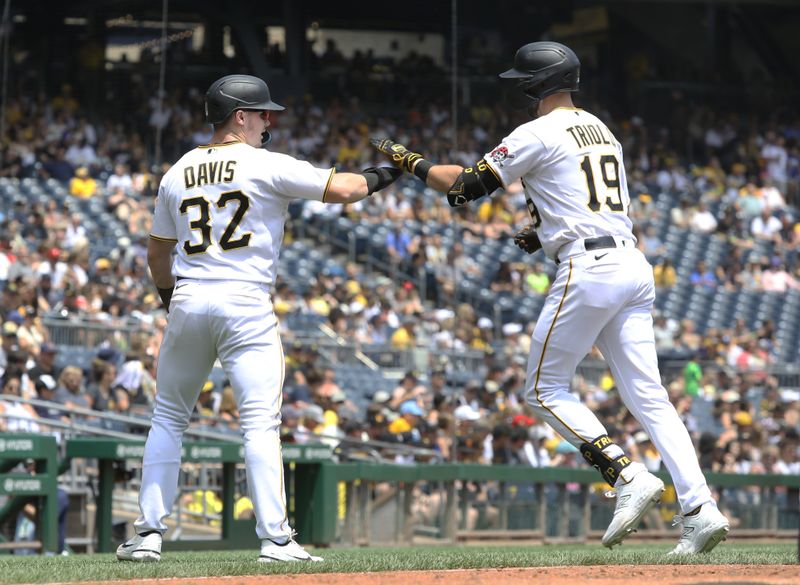 Jul 16, 2023; Pittsburgh, Pennsylvania, USA; Pittsburgh Pirates right fielder Henry Davis (32) and third baseman Jared Triolo (19) celebrate after Davis scored  a run against the San Francisco Giants during the sixth inning at PNC Park. Mandatory Credit: Charles LeClaire-USA TODAY Sports