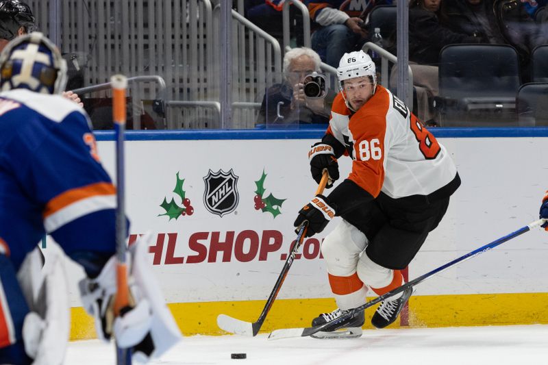 Nov 25, 2023; Elmont, New York, USA; Philadelphia Flyers left wing Joel Farabee (86) controls the puck against the New York Islanders during the third period at UBS Arena. Mandatory Credit: Thomas Salus-USA TODAY Sports