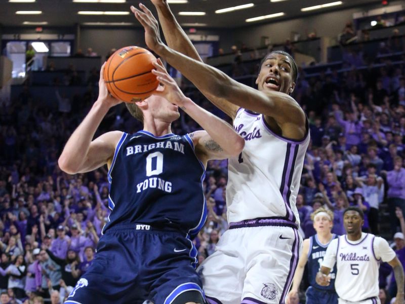 Feb 24, 2024; Manhattan, Kansas, USA; Brigham Young Cougars forward Noah Waterman (0) tries to shoot against Kansas State Wildcats forward David N'Guessan (1) during the second half at Bramlage Coliseum. Mandatory Credit: Scott Sewell-USA TODAY Sports