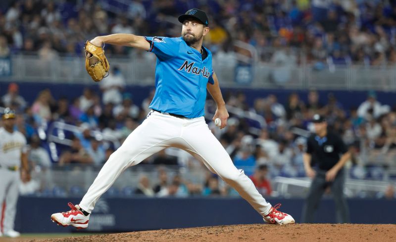 May 4, 2025; Miami, Florida, USA;  Miami Marlins pitcher Anthony Bender (37) pitches against the Oakland Athletics left during the ninth inning at loanDepot Park. Mandatory Credit: Rhona Wise-Imagn Images