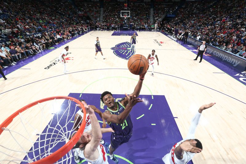 NEW ORLEANS, LA - NOVEMBER 27:  Yves Missi #21 of the New Orleans Pelicans shoots the ball during the game against the Toronto Raptors during a regular season game on November 27, 2024 at the Smoothie King Center in New Orleans, Louisiana. NOTE TO USER: User expressly acknowledges and agrees that, by downloading and or using this Photograph, user is consenting to the terms and conditions of the Getty Images License Agreement. Mandatory Copyright Notice: Copyright 2024 NBAE (Photo by Layne Murdoch Jr./NBAE via Getty Images)