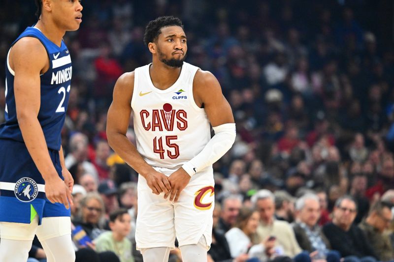 CLEVELAND, OHIO - FEBRUARY 10: Donovan Mitchell #45 of the Cleveland Cavaliers holds his hand after suffering a minor injury during the first quarter against the Minnesota Timberwolves at Rocket Mortgage Fieldhouse on February 10, 2025 in Cleveland, Ohio. NOTE TO USER: User expressly acknowledges and agrees that, by downloading and or using this photograph, User is consenting to the terms and conditions of the Getty Images License Agreement. (Photo by Jason Miller/Getty Images)