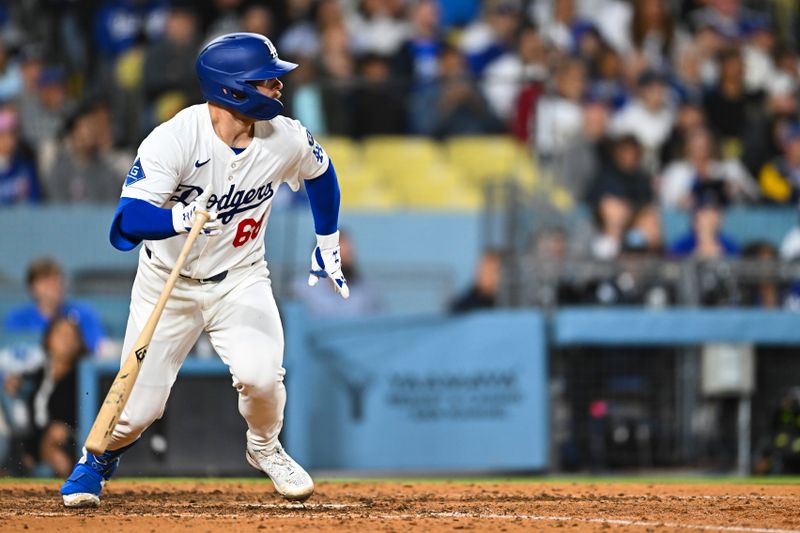 May 17, 2025; Los Angeles, California, USA; Los Angeles Dodgers catcher Dalton Rushing (68) his an RBI single against the Los Angeles Angels during the seventh inning at Dodger Stadium. Mandatory Credit: Jonathan Hui-Imagn Images