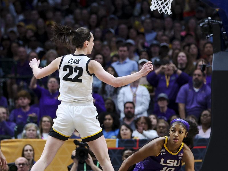 Apr 2, 2023; Dallas, TX, USA; Iowa Hawkeyes guard Caitlin Clark (22) defends against LSU Lady Tigers forward Angel Reese (10) in the first half during the final round of the Women's Final Four NCAA tournament at the American Airlines Center. Mandatory Credit: Kevin Jairaj-USA TODAY Sports