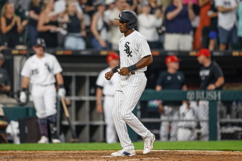 Jul 4, 2023; Chicago, Illinois, USA; Chicago White Sox shortstop Tim Anderson (7) scores against the Toronto Blue Jays during the sixth inning at Guaranteed Rate Field. Mandatory Credit: Kamil Krzaczynski-USA TODAY Sports