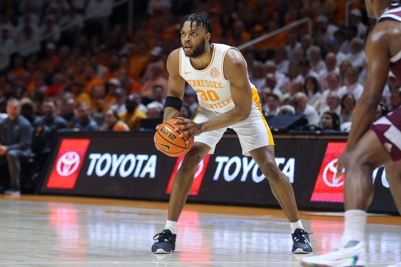 Feb 24, 2024; Knoxville, Tennessee, USA; Tennessee Volunteers guard Josiah-Jordan James (30) looks to move the ball against the Texas A&M Aggies during the first half at Thompson-Boling Arena at Food City Center. Mandatory Credit: Randy Sartin-USA TODAY Sports