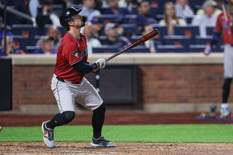 Apr 29, 2025; New York City, New York, USA; Arizona Diamondbacks designated hitter Randal Grichuk (15) doubles during the eighth inning against the New York Mets at Citi Field. Mandatory Credit: Vincent Carchietta-Imagn Images