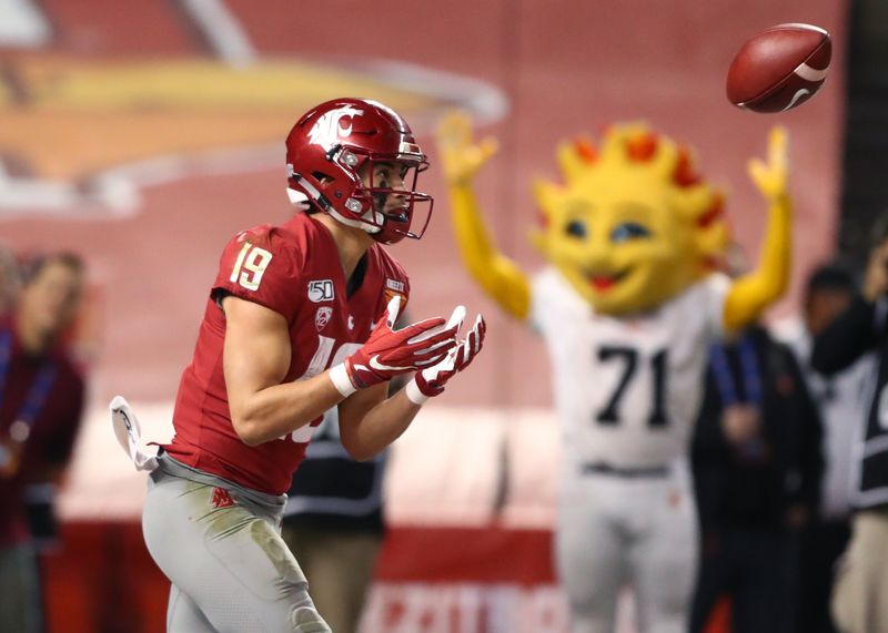 Dec 27, 2019; Phoenix, Arizona, USA; Washington State Cougars wide receiver Brandon Arconado (19) catches a touchdown pass against the Air Force Falcons during the second half of the Cheez-It Bowl at Chase Field. Mandatory Credit: Mark J. Rebilas-USA TODAY Sports