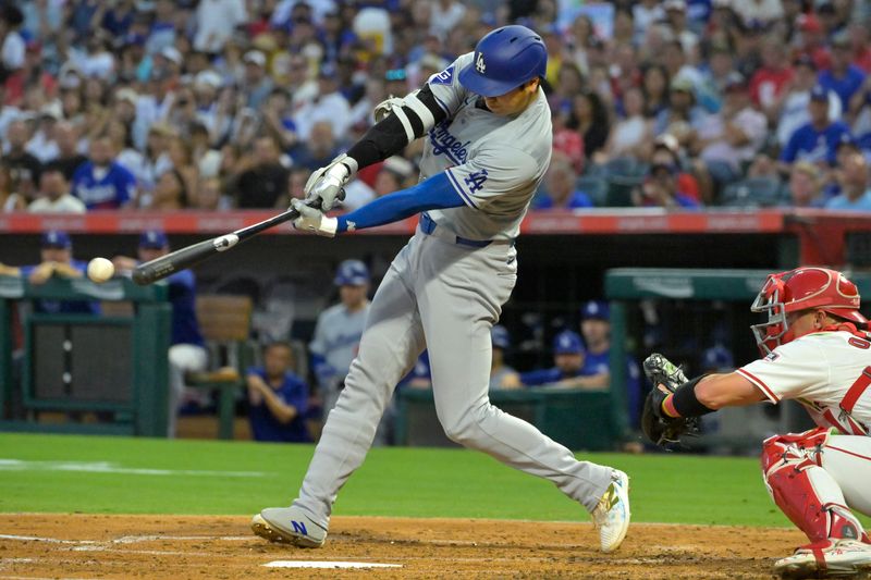 Sep 3, 2024; Anaheim, California, USA;  Los Angeles Dodgers designated hitter Shohei Ohtani (17) hits a triple in the third inning against the Los Angeles Angels at Angel Stadium. Mandatory Credit: Jayne Kamin-Oncea-Imagn Images