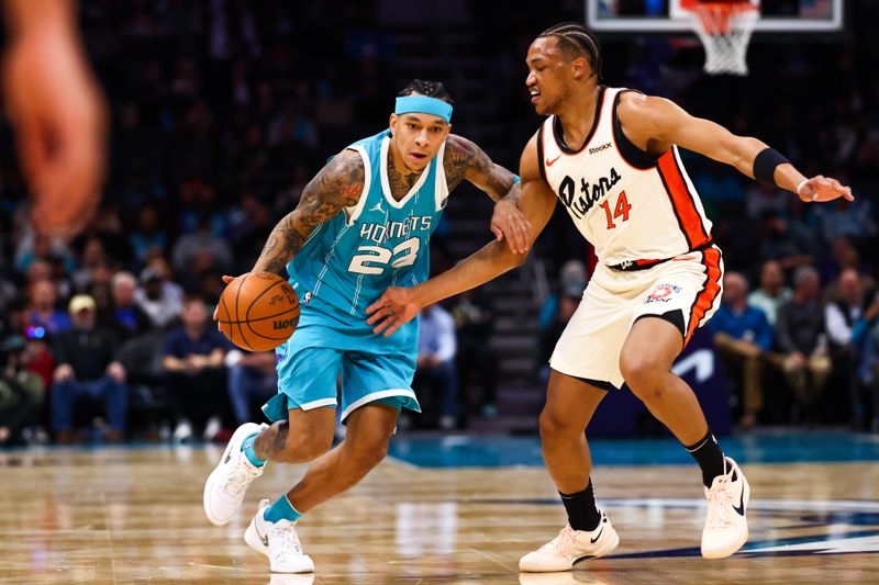 CHARLOTTE, NORTH CAROLINA - NOVEMBER 21: Tre Mann #23 of the Charlotte Hornets drives to the basket during the first half of a basketball game against the Detroit Pistons at Spectrum Center on November 21, 2024 in Charlotte, North Carolina. NOTE TO USER: User expressly acknowledges and agrees that, by downloading and or using this photograph, User is consenting to the terms and conditions of the Getty Images License Agreement. (Photo by David Jensen/Getty Images)