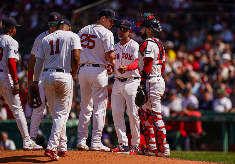 May 2, 2024; Boston, Massachusetts, USA; Boston Red Sox relief pitcher Josh Winckowski (25) is relieved by manager Alex Cora (13) in the fifth inning against the San Francisco Giants at Fenway Park. Mandatory Credit: David Butler II-USA TODAY Sports