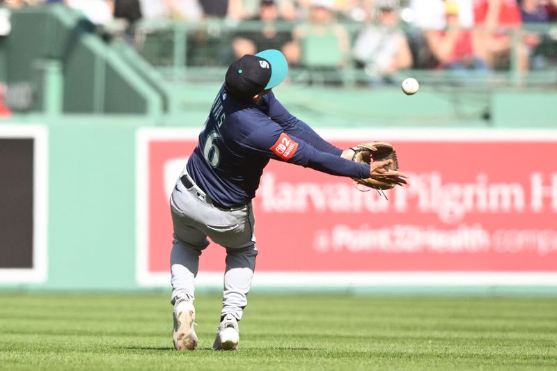Apr 24, 2025; Boston, Massachusetts, USA; Seattle Mariners second base Leo Rivas (76) makes a catch to end  the eighth inning of a game against the Boston Red Sox at Fenway Park. Mandatory Credit: Brian Fluharty-Imagn Images