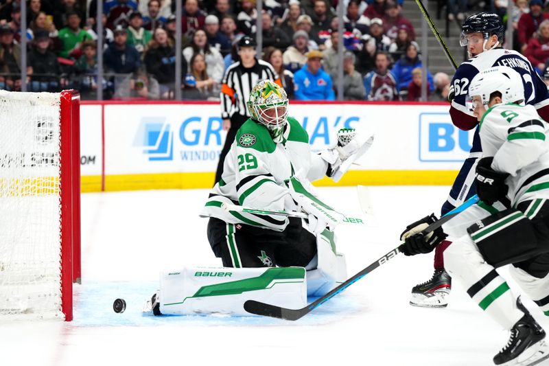 Apr 7, 2024; Denver, Colorado, USA; Dallas Stars goaltender Jake Oettinger (29) makes a save in the second period against the Colorado Avalanche at Ball Arena. Mandatory Credit: Ron Chenoy-USA TODAY Sports