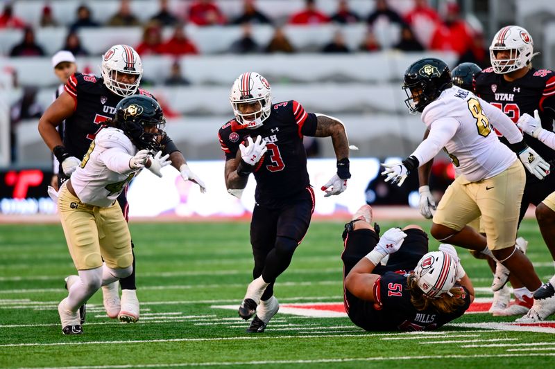 Nov 25, 2023; Salt Lake City, Utah, USA; Utah Utes running back Ja'Quinden Jackson (3) runs the ball through Colorado Buffaloes defense at Rice-Eccles Stadium. Mandatory Credit: Christopher Creveling-USA TODAY Sports