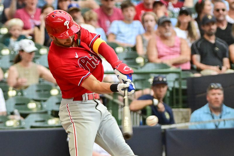 Sep 3, 2023; Milwaukee, Wisconsin, USA; Philadelphia Phillies shortstop Trea Turner (7) hits a single in the sixth inning against the Milwaukee Brewers at American Family Field. Mandatory Credit: Benny Sieu-USA TODAY Sports