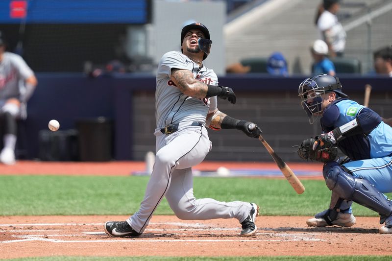 Jul 21, 2024; Toronto, Ontario, CAN;  Detroit Tigers short stop Javier Baez (28) reacts after taking a foul tip off his leg against the Toronto Blue Jays during the third inning at Rogers Centre. Mandatory Credit: John E. Sokolowski-USA TODAY Sports