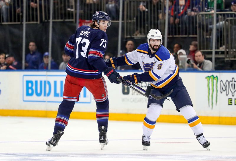 Mar 9, 2024; New York, New York, USA: New York Rangers center Matt Rempe (73) and St. Louis Blues defenseman Nick Leddy (4) get tangled up during the first period at Madison Square Garden. Mandatory Credit: Danny Wild-USA TODAY Sports