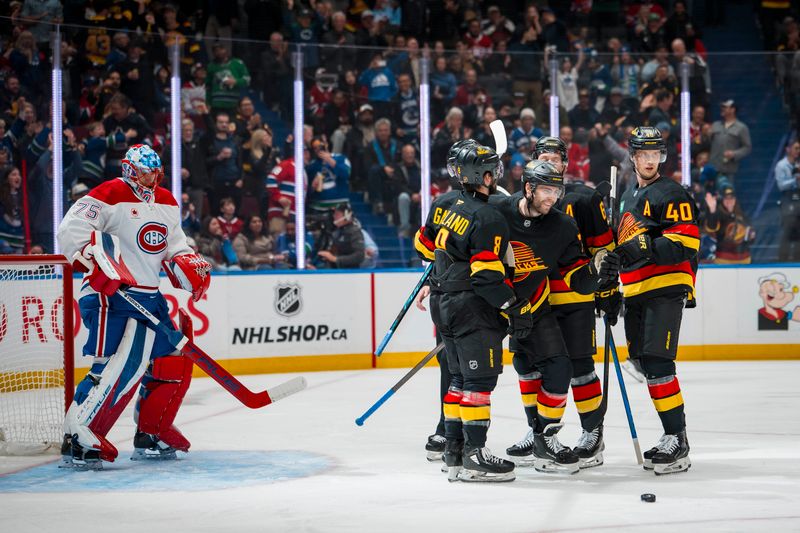 Oct 25, 2025; Vancouver, British Columbia, CAN; Montreal Canadiens goalie Jakub Dobes (75) watches as Vancouver Canucks forward Conor Garland (8) and forward Jake DeBrusk (74) and forward Brock Boeser (6) and forward Elias Pettersson (40) celebrate DeRusk’s goal in the second period at Rogers Arena. Mandatory Credit: Bob Frid-Imagn Images