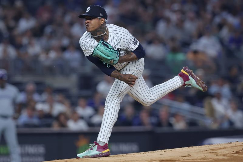 Aug 2, 2024; Bronx, New York, USA; New York Yankees starting pitcher Marcus Stroman (0) follows through on a pitch against the Toronto Blue Jays during the first inning at Yankee Stadium. Mandatory Credit: Brad Penner-USA TODAY Sports