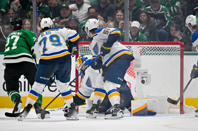 Apr 17, 2024; Dallas, Texas, USA; Dallas Stars left wing Mason Marchment (27) scores the game tying goal against St. Louis Blues goaltender Jordan Binnington (50) during the third period at the American Airlines Center. Mandatory Credit: Jerome Miron-USA TODAY Sports