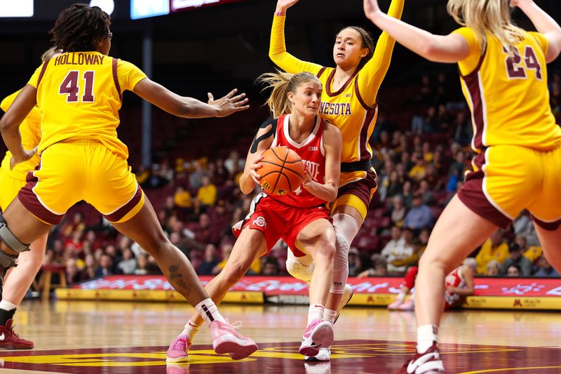 Feb 8, 2024; Minneapolis, Minnesota, USA; Ohio State Buckeyes guard Jacy Sheldon (4) works towards the basket as Minnesota Golden Gophers guard Amaya Battle (3) defends during the second half at Williams Arena. Mandatory Credit: Matt Krohn-USA TODAY Sports