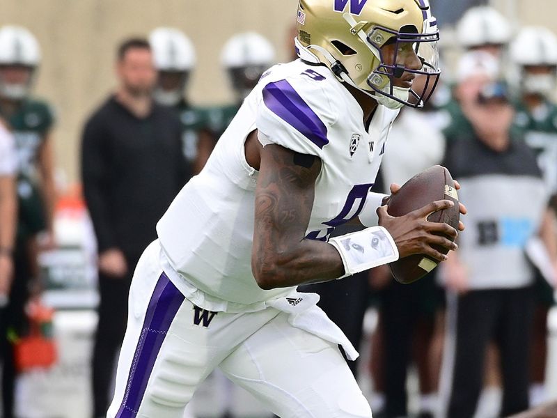 Sep 16, 2023; East Lansing, Michigan, USA; Washington Huskies quarterback Michael Penix Jr. (9) runs the ball against the Michigan State Spartans in the first quarter at Spartan Stadium. Mandatory Credit: Dale Young-USA TODAY Sports