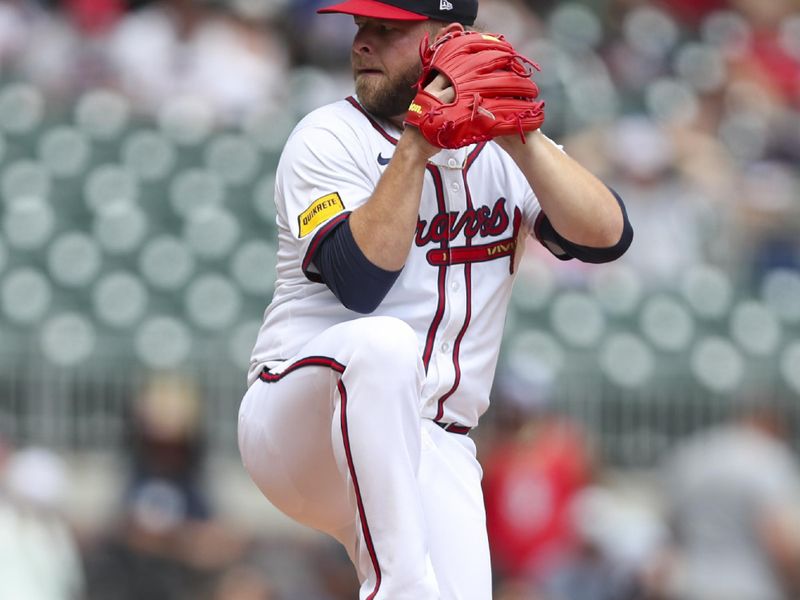 Aug 4, 2024; Cumberland, Georgia, USA; Atlanta Braves relief pitcher A.J. Minter (33) pitches during a game against the Miami Marlins in the ninth inning at Truist Park. Mandatory Credit: Mady Mertens-USA TODAY Sports