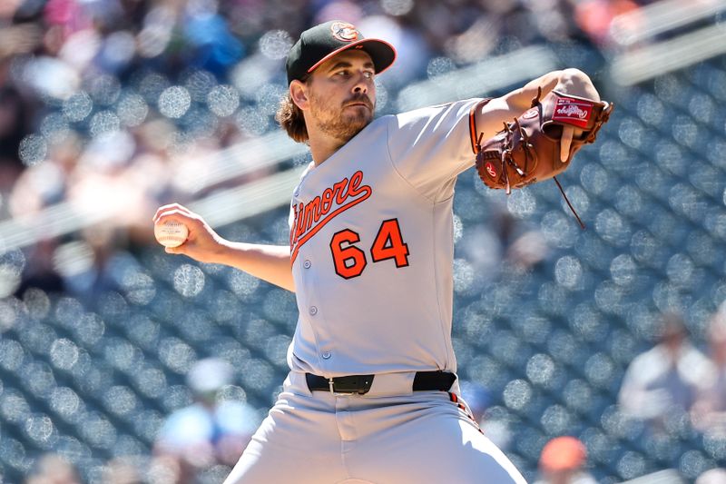May 8, 2025; Minneapolis, Minnesota, USA; Baltimore Orioles starting pitcher Dean Kremer (64) delivers a pitch against the Minnesota Twins during the first inning at Target Field. Mandatory Credit: Matt Krohn-Imagn Images