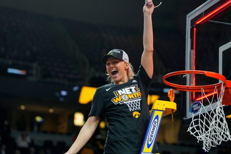 Apr 1, 2024; Albany, NY, USA; Iowa Hawkeyes guard Sydney Affolter (3) cuts the net after defeating the LSU Lady Tigers in the finals of the Albany Regional in the 2024 NCAA Tournament at MVP Arena. Mandatory Credit: Gregory Fisher-USA TODAY Sports