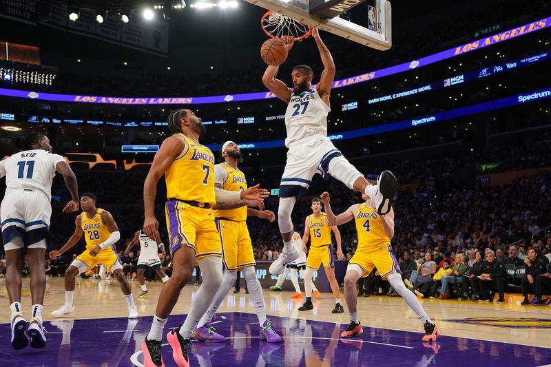 LOS ANGELES, CA - OCTOBER 22: Rudy Gobert #27 of the Minnesota Timberwolves dunks the ball during the game against the Los Angeles Lakers on October 22, 2024 at Crypto.Com Arena in Los Angeles, California. NOTE TO USER: User expressly acknowledges and agrees that, by downloading and/or using this Photograph, user is consenting to the terms and conditions of the Getty Images License Agreement. Mandatory Copyright Notice: Copyright 2024 NBAE (Photo by Garrett Ellwood/NBAE via Getty Images)