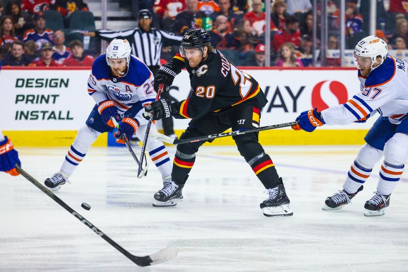 Apr 6, 2024; Calgary, Alberta, CAN; Calgary Flames center Blake Coleman (20) battles for the puck with Edmonton Oilers center Connor McDavid (97) and center Leon Draisaitl (29) during the second period at Scotiabank Saddledome. Mandatory Credit: Sergei Belski-USA TODAY Sports