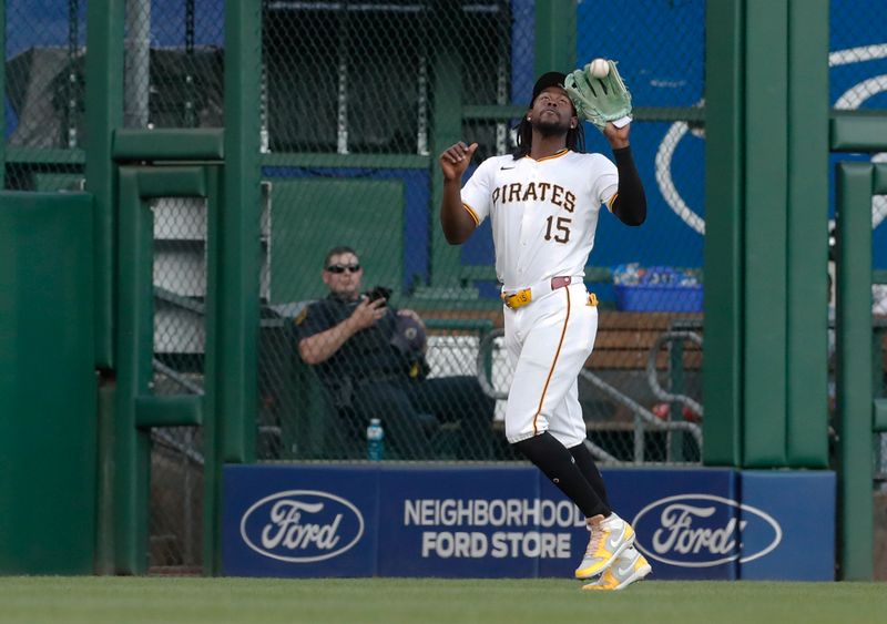 Sep 5, 2024; Pittsburgh, Pennsylvania, USA;  Pittsburgh Pirates center fielder Oneil Cruz (15) catches a ball hit by first baseman Juan Yepez (not pictured) for the third out of the second inning at PNC Park. Mandatory Credit: Charles LeClaire-Imagn Images