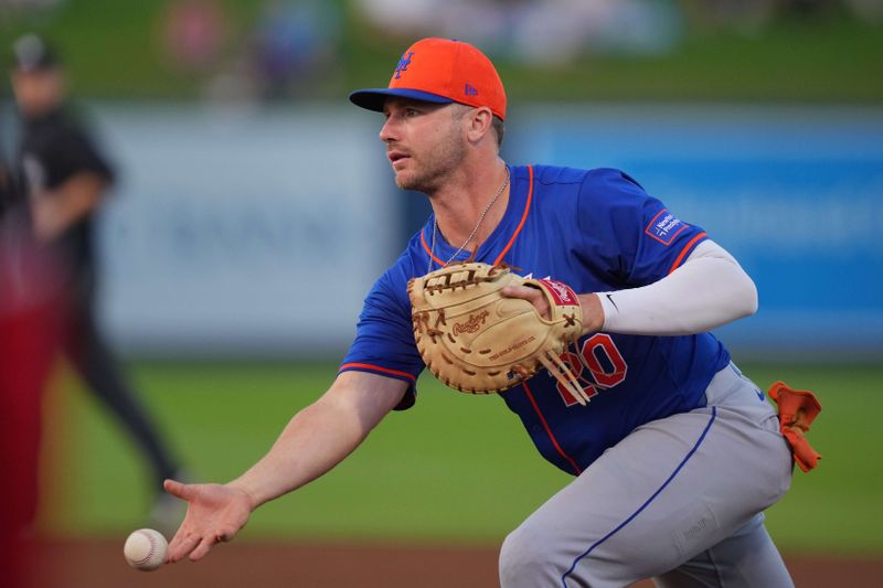 Mar 12, 2024; West Palm Beach, Florida, USA;  New York Mets first baseman Pete Alonso (20) tosses the ball to the pitcher covering first base in the fifth inning against the Washington Nationals at The Ballpark of the Palm Beaches. Mandatory Credit: Jim Rassol-USA TODAY Sports