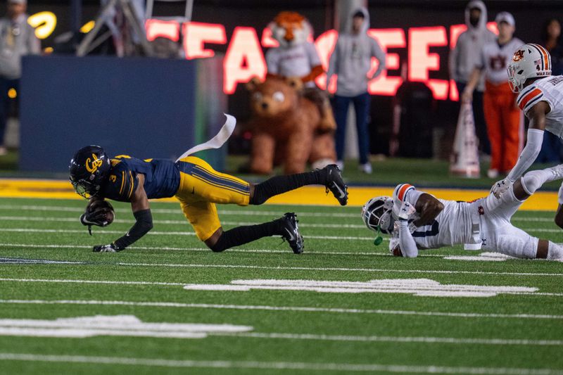 Sep 9, 2023; Berkeley, California, USA; California Golden Bears wide receiver Jeremiah Hunter (3) is tackled by Auburn Tigers cornerback Keionte Scott (0) during the second quarter at California Memorial Stadium. Mandatory Credit: Neville E. Guard-USA TODAY Sports