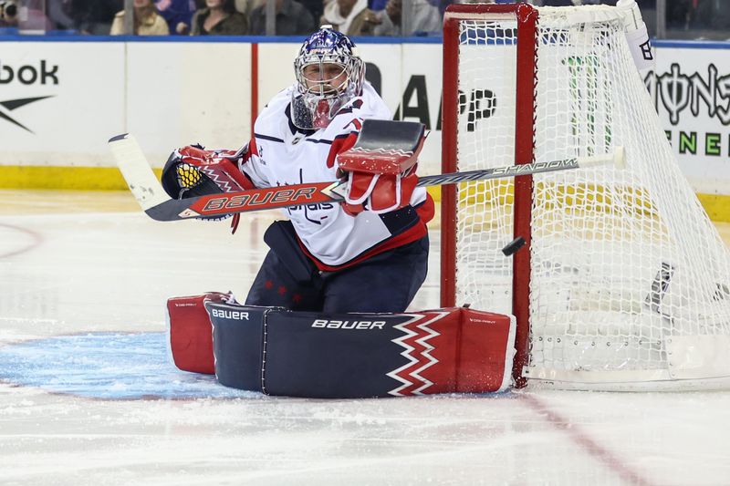 Oct 12, 2025; New York, New York, USA;  Washington Capitals goaltender Charlie Lindgren (79) makes a save on a shot on goal attempt in the second period against the New York Rangers at Madison Square Garden. Mandatory Credit: Wendell Cruz-Imagn Images