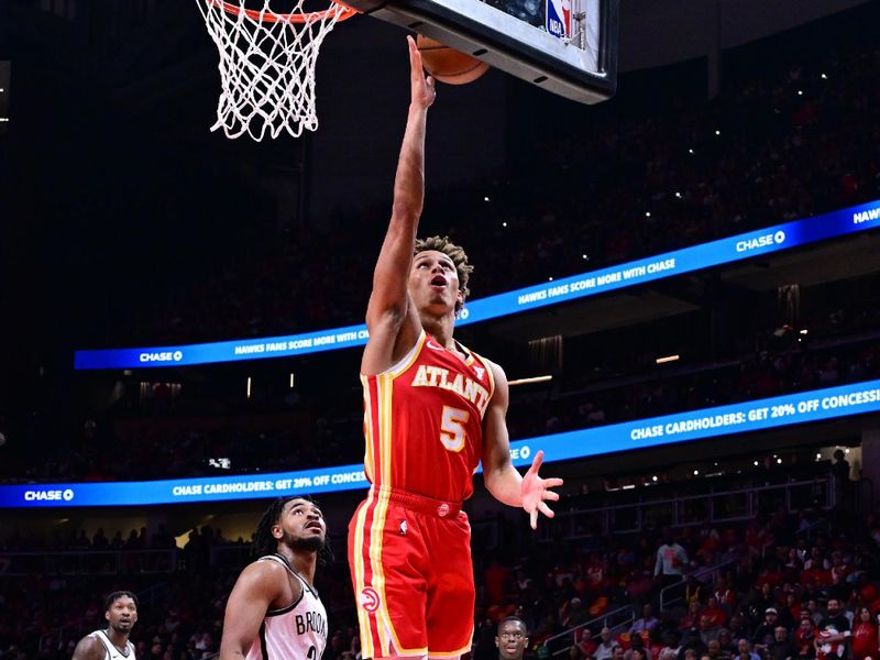 ATLANTA, GA - OCTOBER 23: Dyson Daniels #5 of the Atlanta Hawks shoots the ball during the game against the Brooklyn Nets on October 23, 2024 at State Farm Arena in Atlanta, Georgia.  NOTE TO USER: User expressly acknowledges and agrees that, by downloading and/or using this Photograph, user is consenting to the terms and conditions of the Getty Images License Agreement. Mandatory Copyright Notice: Copyright 2024 NBAE (Photo by Adam Hagy/NBAE via Getty Images)