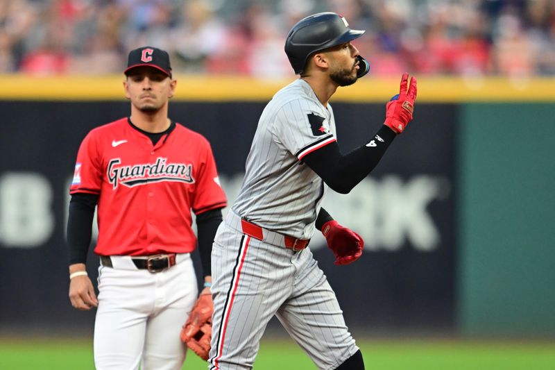 Sep 16, 2024; Cleveland, Ohio, USA; Minnesota Twins shortstop Carlos Correa (4) reacts after hitting a double during the third inning against the Cleveland Guardians at Progressive Field. Mandatory Credit: Ken Blaze-Imagn Images