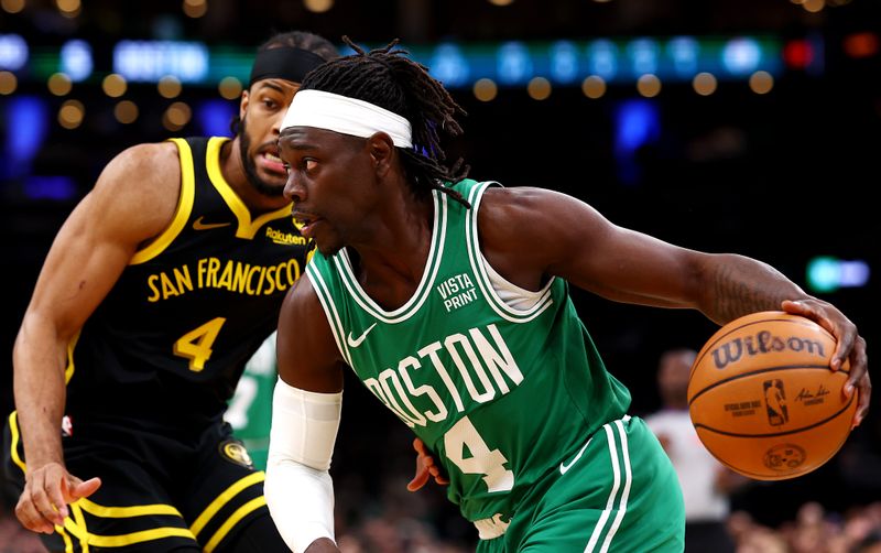 BOSTON, MASSACHUSETTS - MARCH 03: Moses Moody #4 of the Golden State Warriors defends Jrue Holiday #4 of the Boston Celtics during the first quarter at TD Garden on March 03, 2024 in Boston, Massachusetts. NOTE TO USER: User expressly acknowledges and agrees that, by downloading and or using this photograph, user is consenting to the terms and conditions of the Getty Images License Agreement.  (Photo by Maddie Meyer/Getty Images)