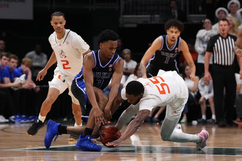 Feb 6, 2023; Coral Gables, Florida, USA; Miami Hurricanes guard Wooga Poplar (55) battles Duke Blue Devils guard Jeremy Roach (3) for a loose ball during the second half at Watsco Center. Mandatory Credit: Jasen Vinlove-USA TODAY Sports