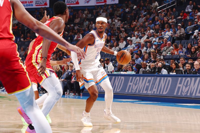 OKLAHOMA CITY, OK - OCTOBER 17: Shai Gilgeous-Alexander #2 of the Oklahoma City Thunder looks to pass the ball during the game against the Atlanta Hawks  on October 17, 2024 at Paycom Arena in Oklahoma City, Oklahoma. NOTE TO USER: User expressly acknowledges and agrees that, by downloading and or using this photograph, User is consenting to the terms and conditions of the Getty Images License Agreement. Mandatory Copyright Notice: Copyright 2024 NBAE (Photo by Zach Beeker/NBAE via Getty Images)