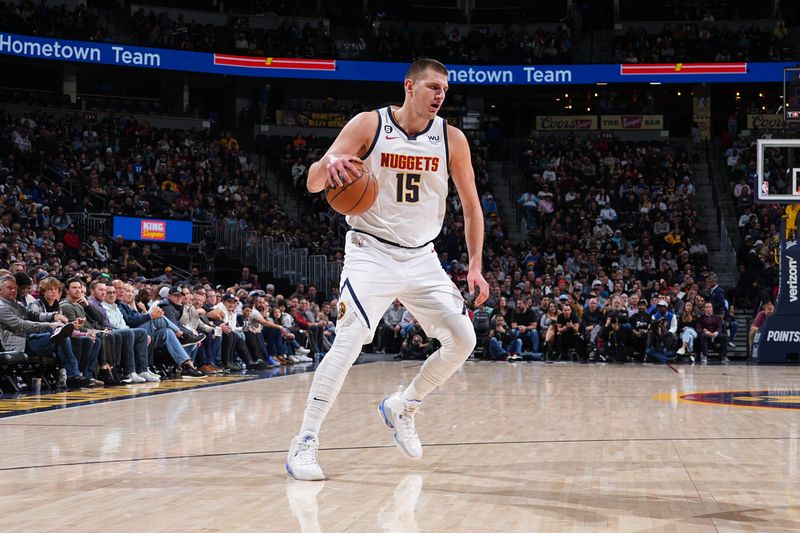 DENVER, CO - DECEMBER 14: Nikola Jokic #15 of the Denver Nuggets dribbles the ball during the game against the Washington Wizards on December 14, 2022 at the Ball Arena in Denver, Colorado. NOTE TO USER: User expressly acknowledges and agrees that, by downloading and/or using this Photograph, user is consenting to the terms and conditions of the Getty Images License Agreement. Mandatory Copyright Notice: Copyright 2022 NBAE (Photo by Bart Young/NBAE via Getty Images)