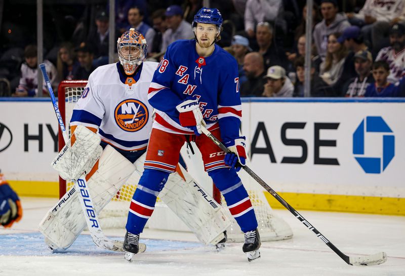 Sep 24, 2024; New York, New York, USA; New York Rangers left wing Brennan Othmann (78) in front of New York Islanders goalie Semyon Varlamov (40) during the first period at Madison Square Garden. Mandatory Credit: Danny Wild-Imagn Images