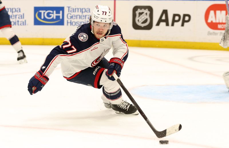 Apr 9, 2024; Tampa, Florida, USA; Columbus Blue Jackets defenseman Nick Blankenburg (77) skates with the puck against the Tampa Bay Lightning during the third period at Amalie Arena. Mandatory Credit: Kim Klement Neitzel-USA TODAY Sports